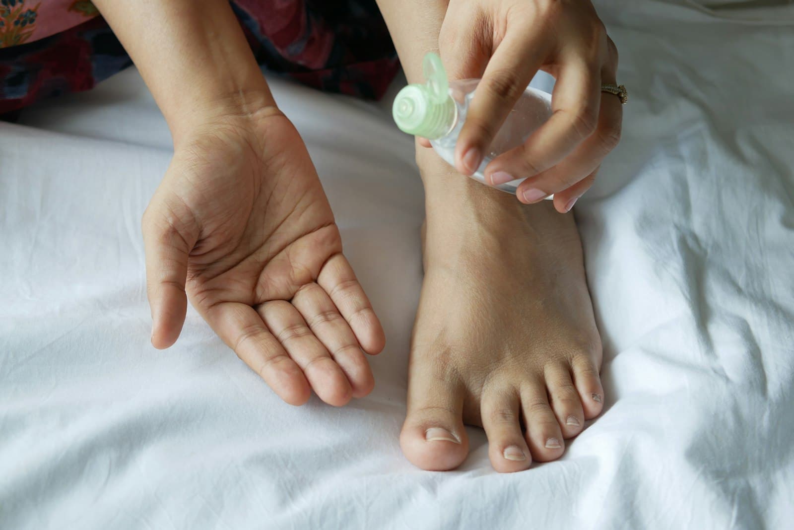 A foot treatment being carried out on fresh white linen