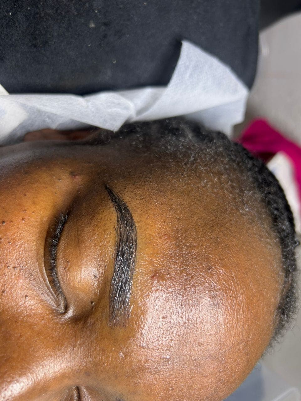 A finished brow shape on a client at Nallo Lashes and Beauty